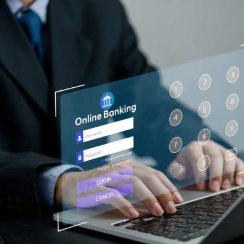 Businessman use laptops to work on digital marketing and data management,Online banking and digital money concept. Global network cybersecurity technology.
