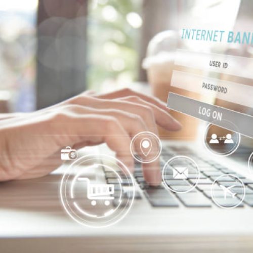 business hand using computer internet banking. can used for cover page presentation and web banner. e-commerce internet technology concept.