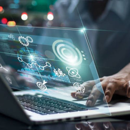 Data scientists. Male programmer using laptop analyzing and developing in various information on futuristic virtual interface screen. Algorithm. marketing and deep learning of artificial intelligence